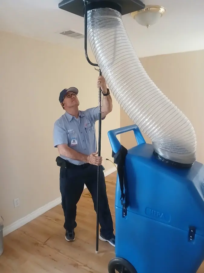 Furnace Tune-Up technician using HEPA equipment in Deerfield